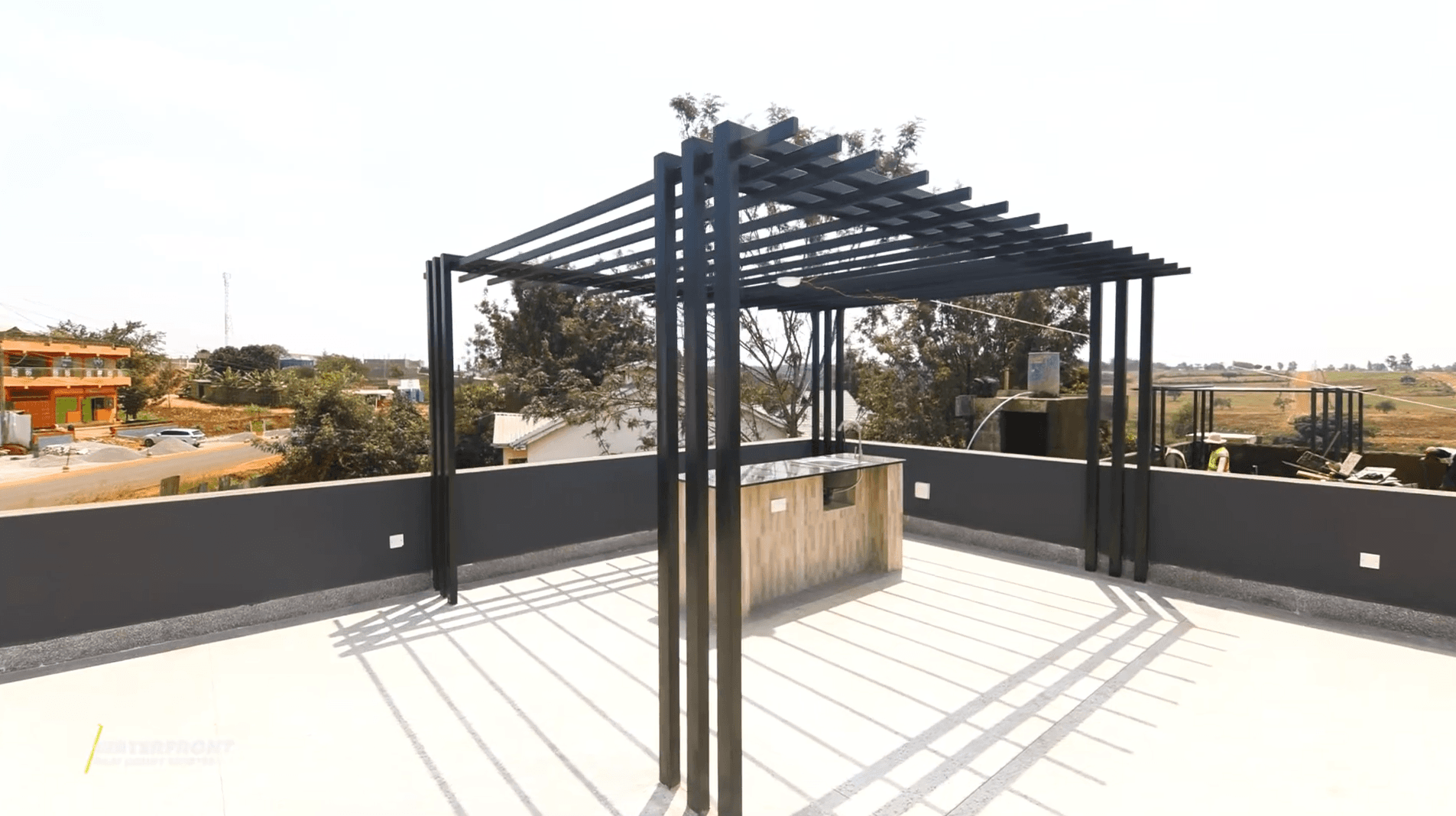 Palm Courts Estates rooftop terrace with pergola