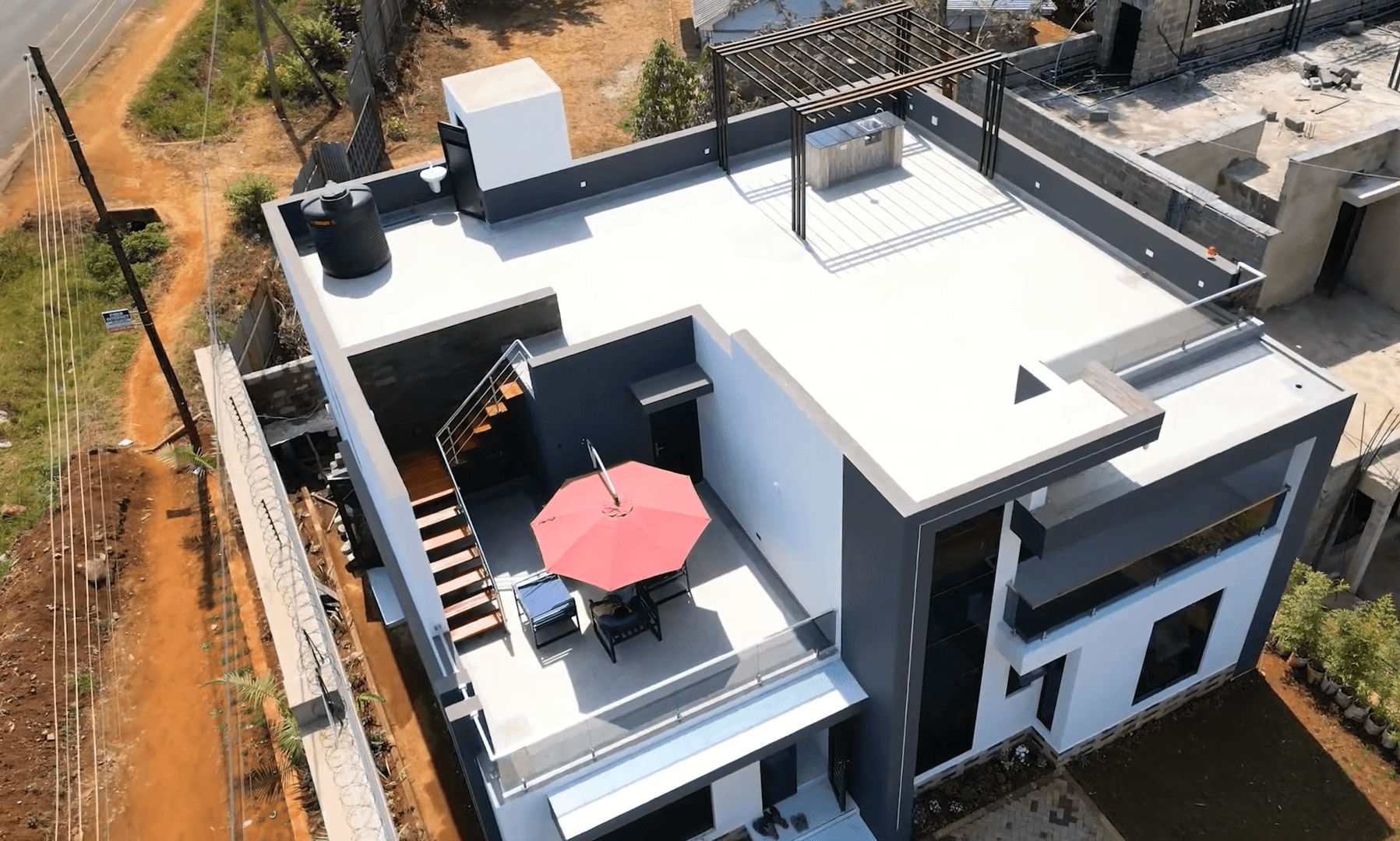 Aerial drone view of Palm Courts villa rooftop terrace