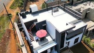 Aerial view of villa rooftop with outdoor terrace furniture