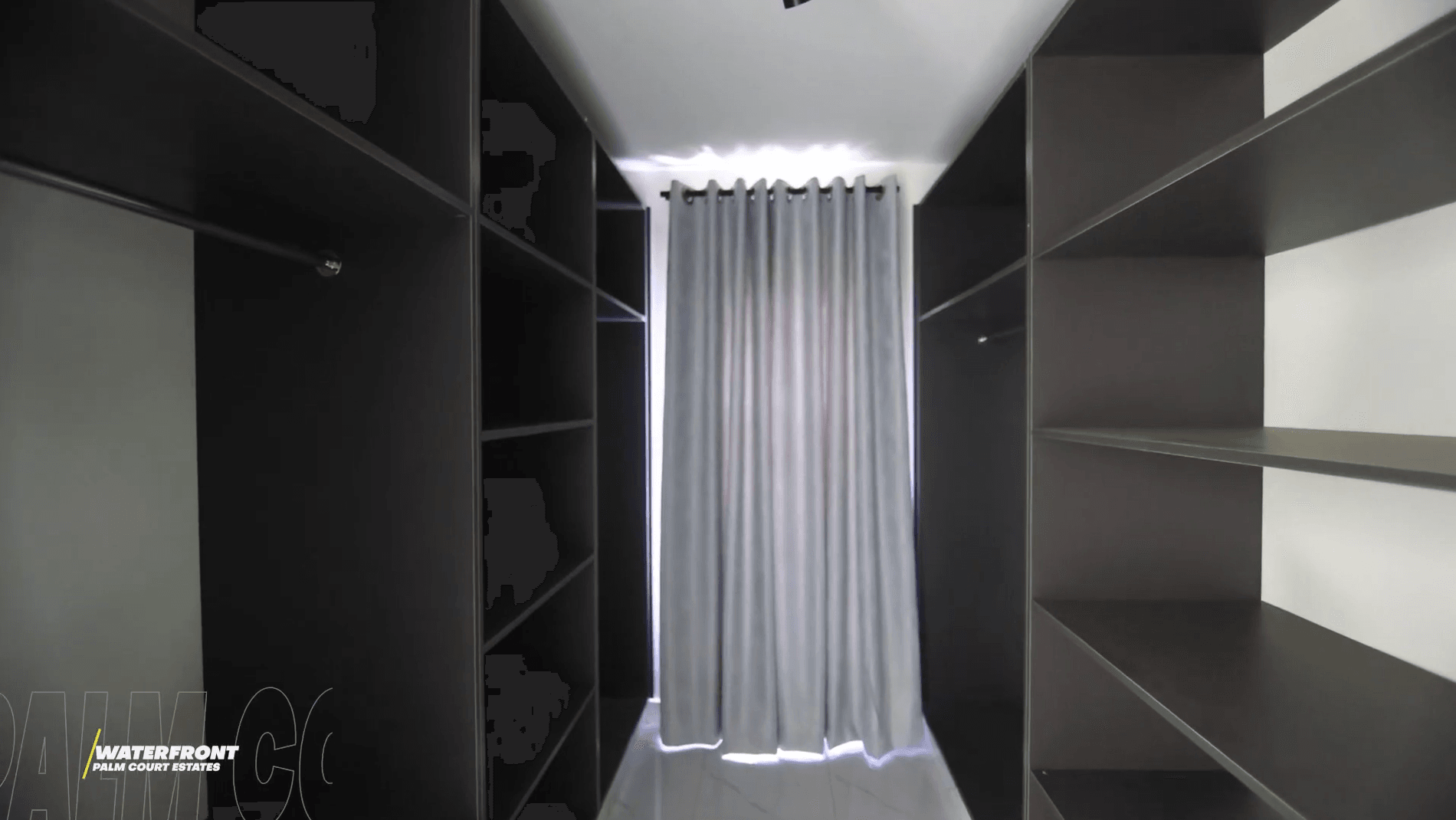 Fitted walk-in wardrobe with backlit shelving